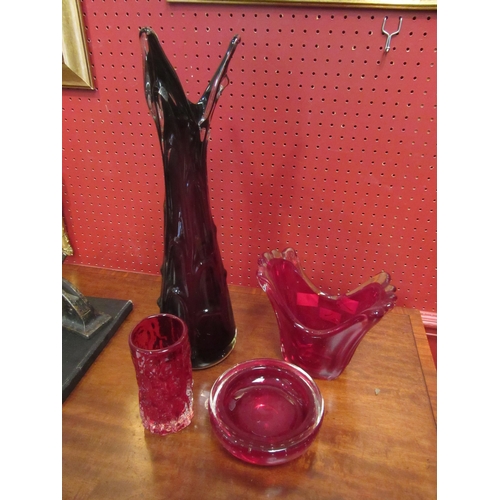 4061 - Four pieces of ruby glassware, a Czech art glass vase by Karlovarske, 47cm high, a splash vase, 16cm... 