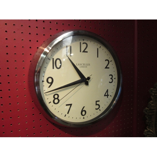 4064 - A Lascelles, London, battery operated wall clock, sweep second hand. 25cm dial diameter