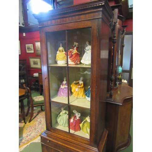 4078 - A George III revival mahogany full height narrow pier cabinet, the panel glazed door over a brushing... 