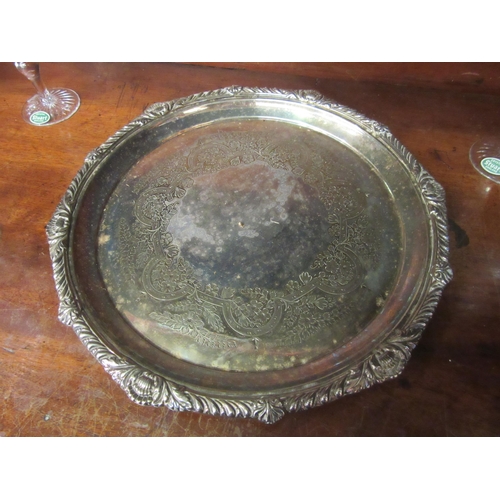 4079 - A silver plated tray, 27cm diameter, with six Stuart crystal sherry glasses