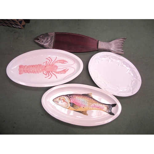 4115 - An Italian ceramic platter embossed with a fish, a similar example embossed with a crawfish, a blanc... 