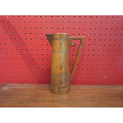 4125 - An Arts & Crafts wooden jug, 18.5cm height