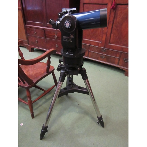 4199 - A Meade ETX telescope on tripod, with bag and case containing accessories including Autostar remote ... 