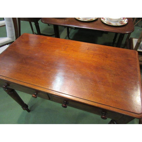 4211 - A late Victorian mahogany side table, the round corner top over two frieze drawers on turned and tap... 