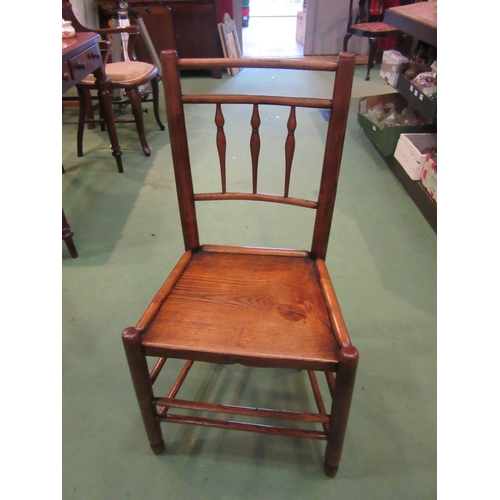 4212 - A Northwest 18th Century elm chair with turned spindle back rest over a flat seat