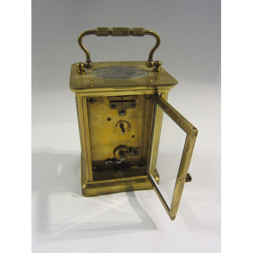 4370 - A Bedford & Son brass carriage clock with enamel Roman numeral dial, 11cm tall