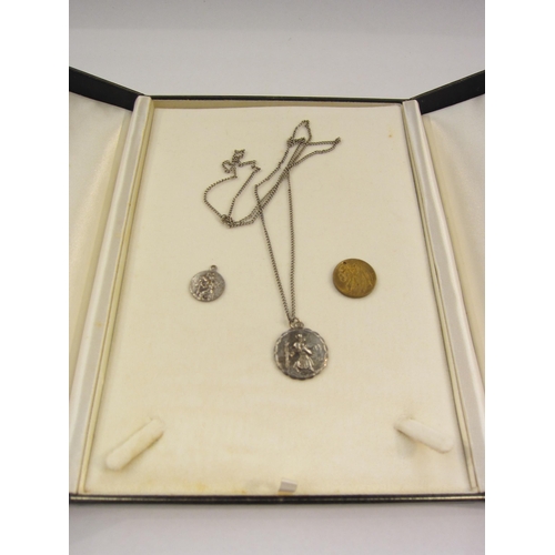 4409 - A George Jensen silver St Christopher pendant hung on chain and two other St Christoper pendants