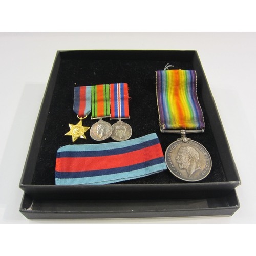 4416 - A bar of three miniature WWII service medals and a 1914 -1918 medal and ribbon