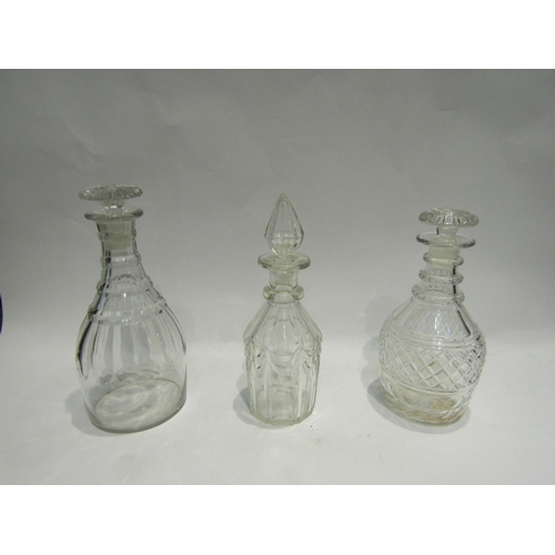 4427 - A cut glass mallet form decanter, a similar example and a cut glass decanter with swag design (3)