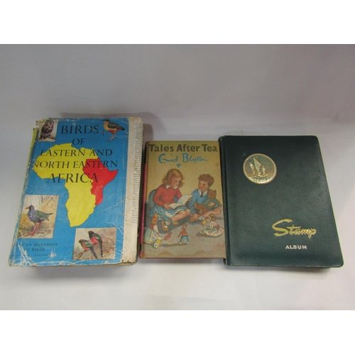 4320 - A selection of ephemera including a World stamp album, Enid Blyton 