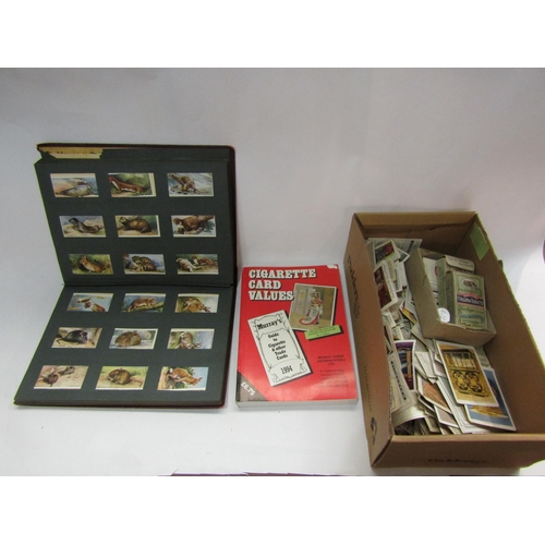 4350 - A box of miscellaneous cigarette cards to include card albums, loose cards, cigarette card values vo... 