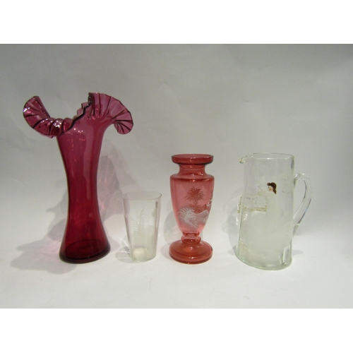 4464 - A Mary Gregory style clear glass jug and matching beaker, together with a cranberry vase, 27.5cm tal... 