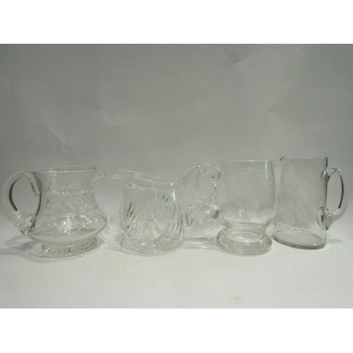 4473 - Four crystal and etched glass jugs, various sizes and designs