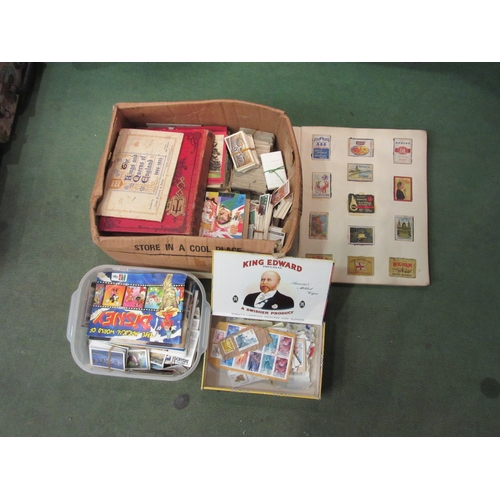 4221 - A box of World stamps including album and cigarette cards including animals