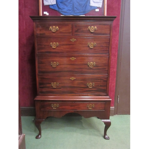4222 - A Georgian mahogany chest on stand of two short over four long drawers with shaped apron and spade f... 