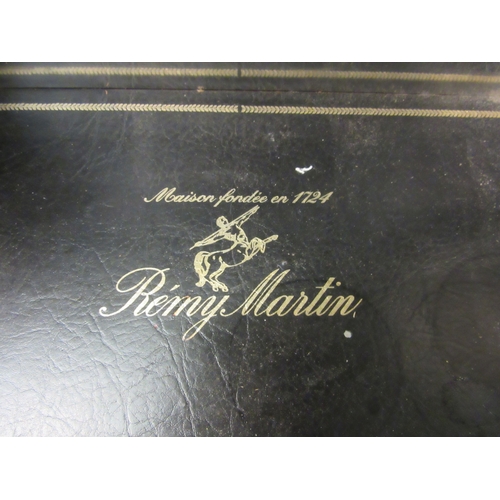 4224 - A Remy Martin Cognac mirrored tantalus with key. 32cm tall x 26cm deep X 40cm wide