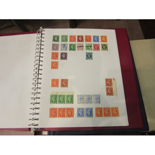 4225 - A stamp album part filled with British stamps, an album of World stamps, a similar album, and a Sena... 