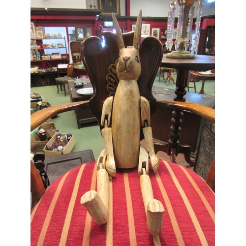 4241 - A wooden articulated hare, 72cm tall