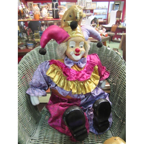 4251 - Four clowns, three with porcelain heads, the two smaller being clockwork musical, tallest 43cm