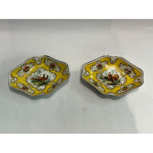 4315 - A pair of Beyer & Bock porcelain lozenge form dishes, yellow ground with transfer printed pheasant a... 