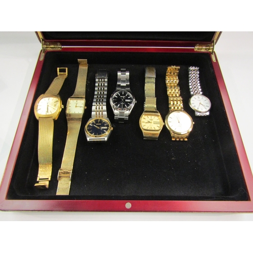 4384 - A jewellery box with contents including wristwatches, silver jewellery etc.