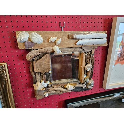 1047 - A driftwood mirror applied with shells (mirror plate 14cm x 14cm)