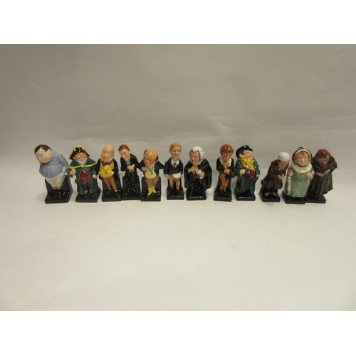 4383 - A set of twenty four Charles Dickens miniature character figures including 