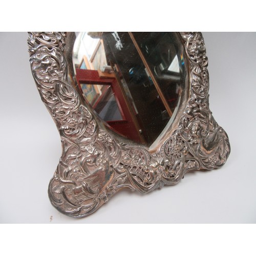 6374 - A William Comyns silver highly ornate mirror frame decorated with birds, flowers and leaves, heart s... 