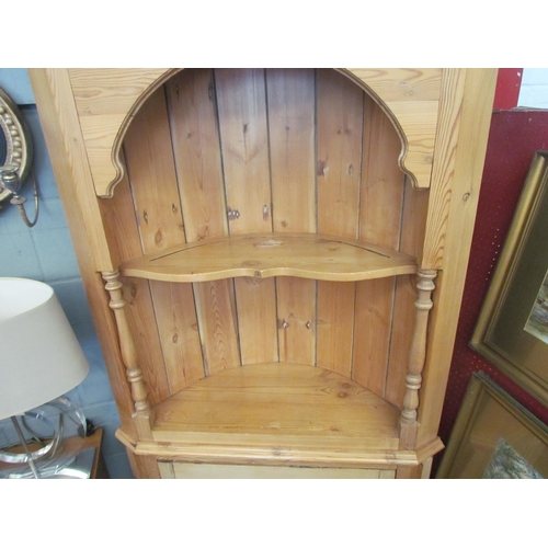 1007 - A natural pine Victorian style barrel back corner cupboard with turned pilasters over a single door ... 