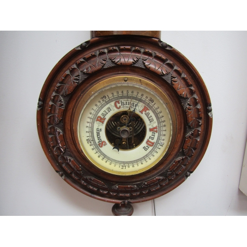 1047 - A 20th Century wall barometer with finial design, 46cm tall