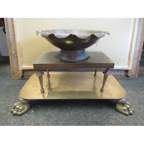 1058 - A brass lion footing display stand together with another and a copper Arts & Crafts style bowl (3)