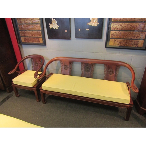 1076 - An Oriental rosewood lounge set consisting of four armchairs and one settee, pierced fretwork back s... 