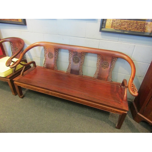 1076 - An Oriental rosewood lounge set consisting of four armchairs and one settee, pierced fretwork back s... 