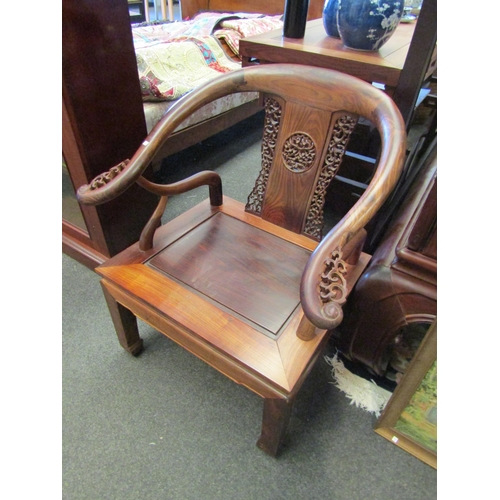 1076 - An Oriental rosewood lounge set consisting of four armchairs and one settee, pierced fretwork back s... 