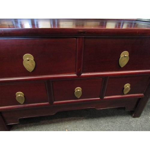 1094 - A Chinese hardwood chest of two over three short drawers, brass pendant handles, shaped frieze, 55cm... 