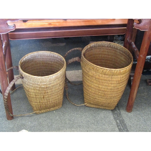 1099 - Two Oriental woven collecting carriers, largest 43cm tall x 36cm diameter