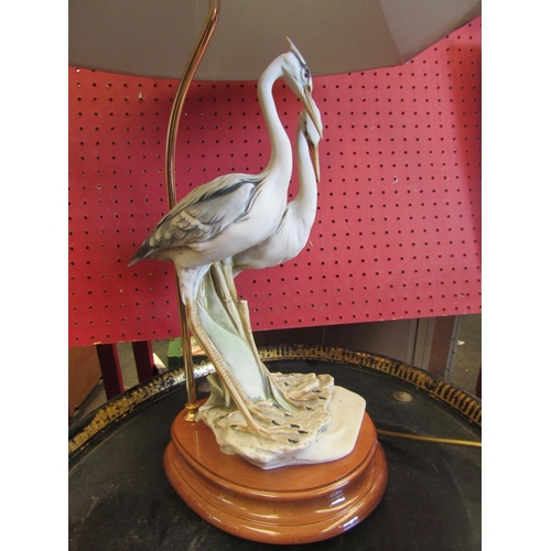 1105 - A Capodimonte Heron figural table lamp with shade. Stamped 1984 Florence. Indistinctly signed. Overa... 