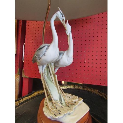 1105 - A Capodimonte Heron figural table lamp with shade. Stamped 1984 Florence. Indistinctly signed. Overa... 