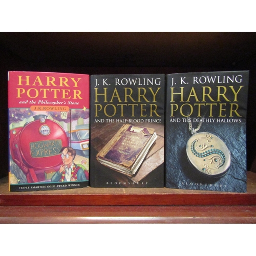 1109 - Three J.K. Rowling Harry Potter novels, including 'Harry Potter and the Philosopher's Stone', London... 