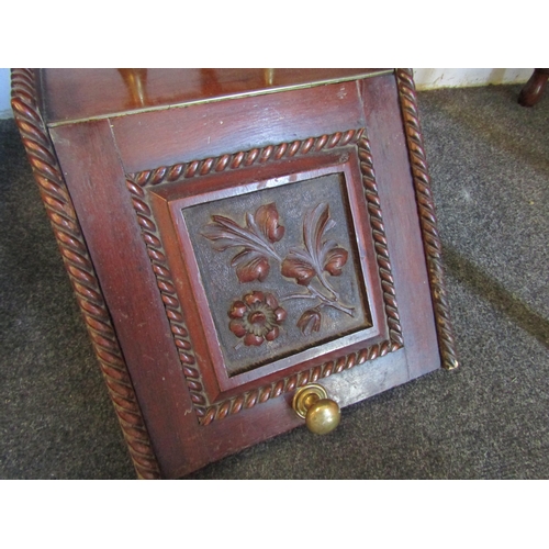 1017 - An early 20th Century mahogany coal box and shovel with brass furniture and foliate carving