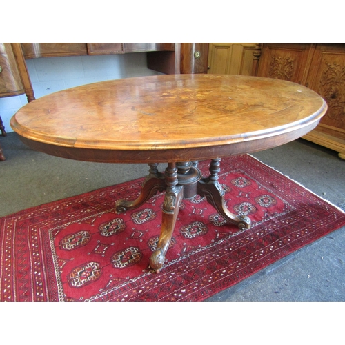 1024 - A Victorian walnut oval top loo table, marquetry inlay, 72cm tall x 130cm long x 95cm wide