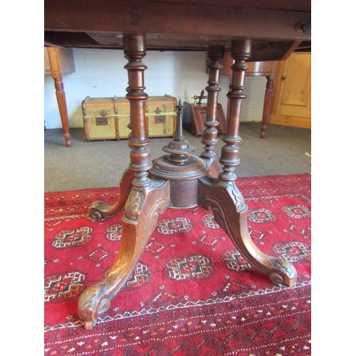 1024 - A Victorian walnut oval top loo table, marquetry inlay, 72cm tall x 130cm long x 95cm wide