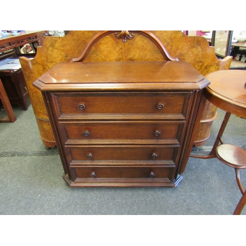 1101 - An oak canted corner four drawer chest, 77cm tall x 85cm wide x 41cm deep