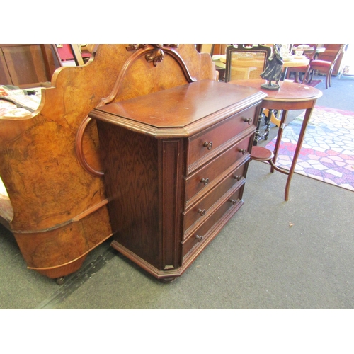 1101 - An oak canted corner four drawer chest, 77cm tall x 85cm wide x 41cm deep