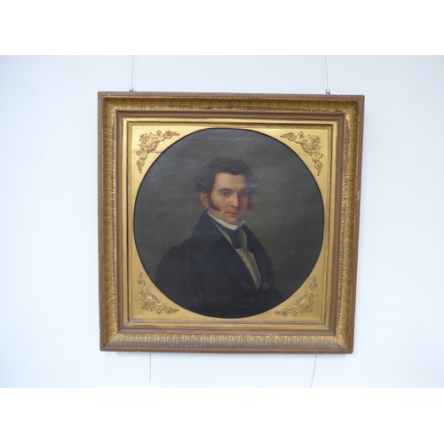 7045 - A 19th Century oil on canvas of a Gentleman. Set in a gilt frame with circular gilt mount with appli... 