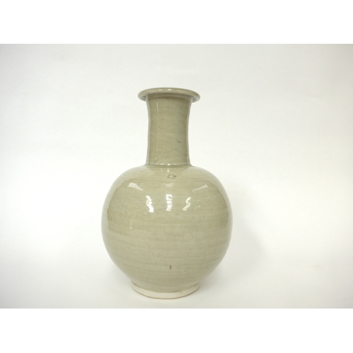 7143 - WILLIAM 'BILL' MARSHALL (1923-2007) A studio pottery porcelain bottle vase, pale celedon glaze, impr... 