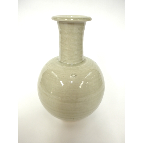 7143 - WILLIAM 'BILL' MARSHALL (1923-2007) A studio pottery porcelain bottle vase, pale celedon glaze, impr... 