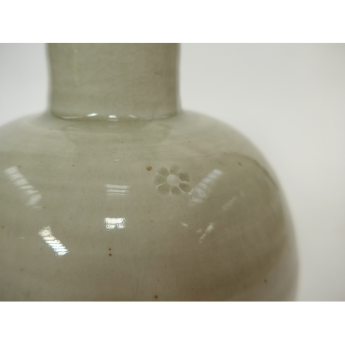 7143 - WILLIAM 'BILL' MARSHALL (1923-2007) A studio pottery porcelain bottle vase, pale celedon glaze, impr... 