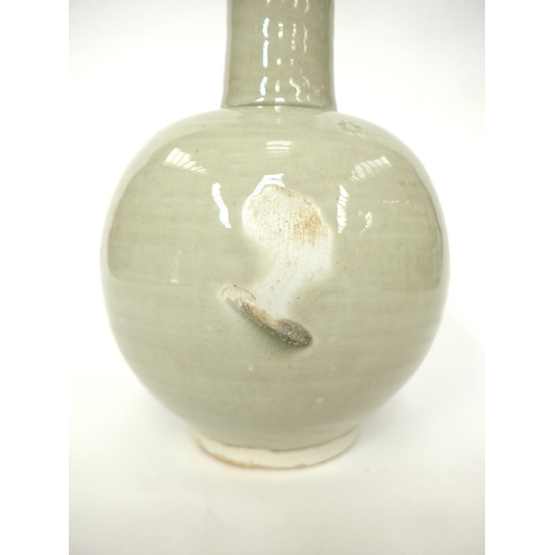 7143 - WILLIAM 'BILL' MARSHALL (1923-2007) A studio pottery porcelain bottle vase, pale celedon glaze, impr... 