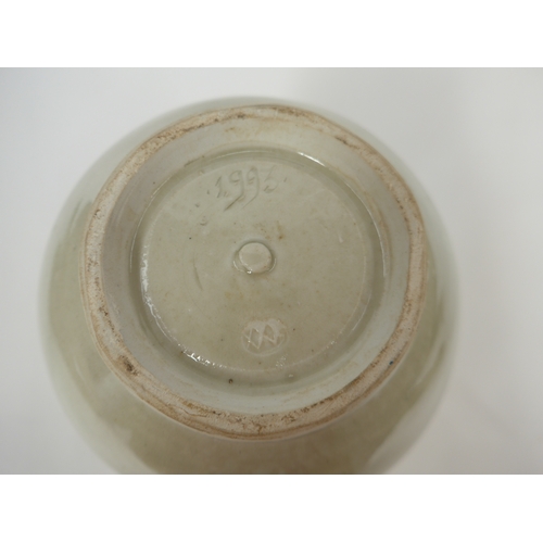 7143 - WILLIAM 'BILL' MARSHALL (1923-2007) A studio pottery porcelain bottle vase, pale celedon glaze, impr... 